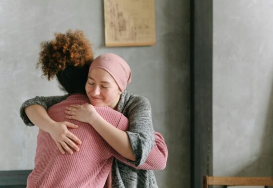 Woman hugging another woman